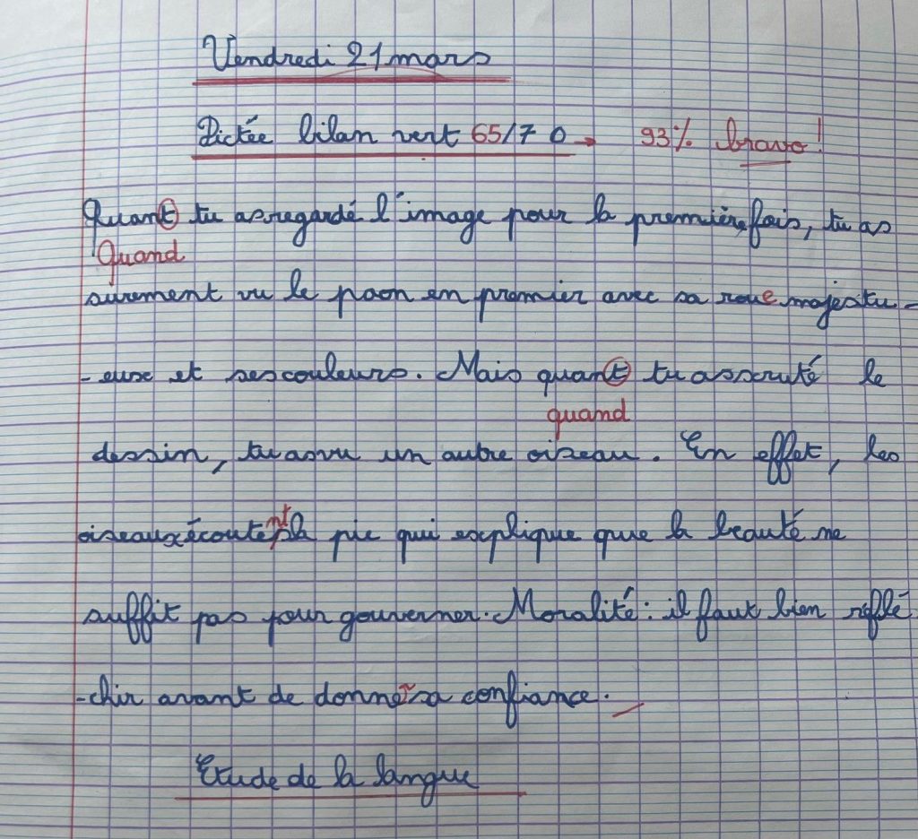Texte écrit par un élève sur cahier à grands carreaux
